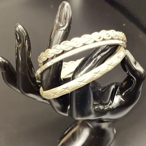 Ladies Mexican silver bangles, braided and stamped, 1/8” to 1/4” in width.